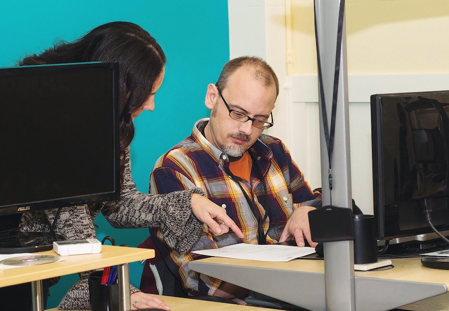 RufusTech employees working on a solution for a valued client