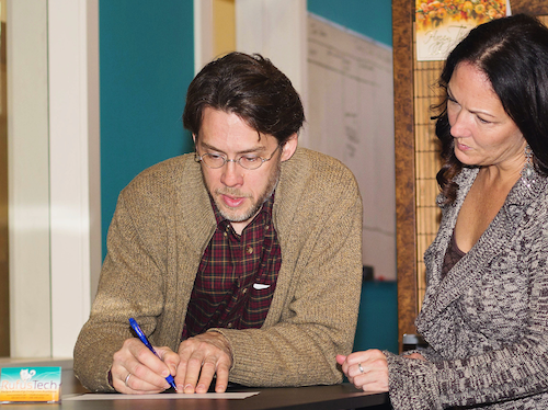 Picture of staff figuring out how to solve something.